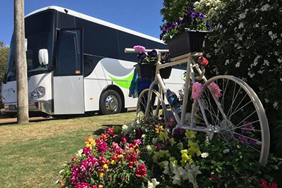 One of Lonestars buses taking a same interest group to a flower show.